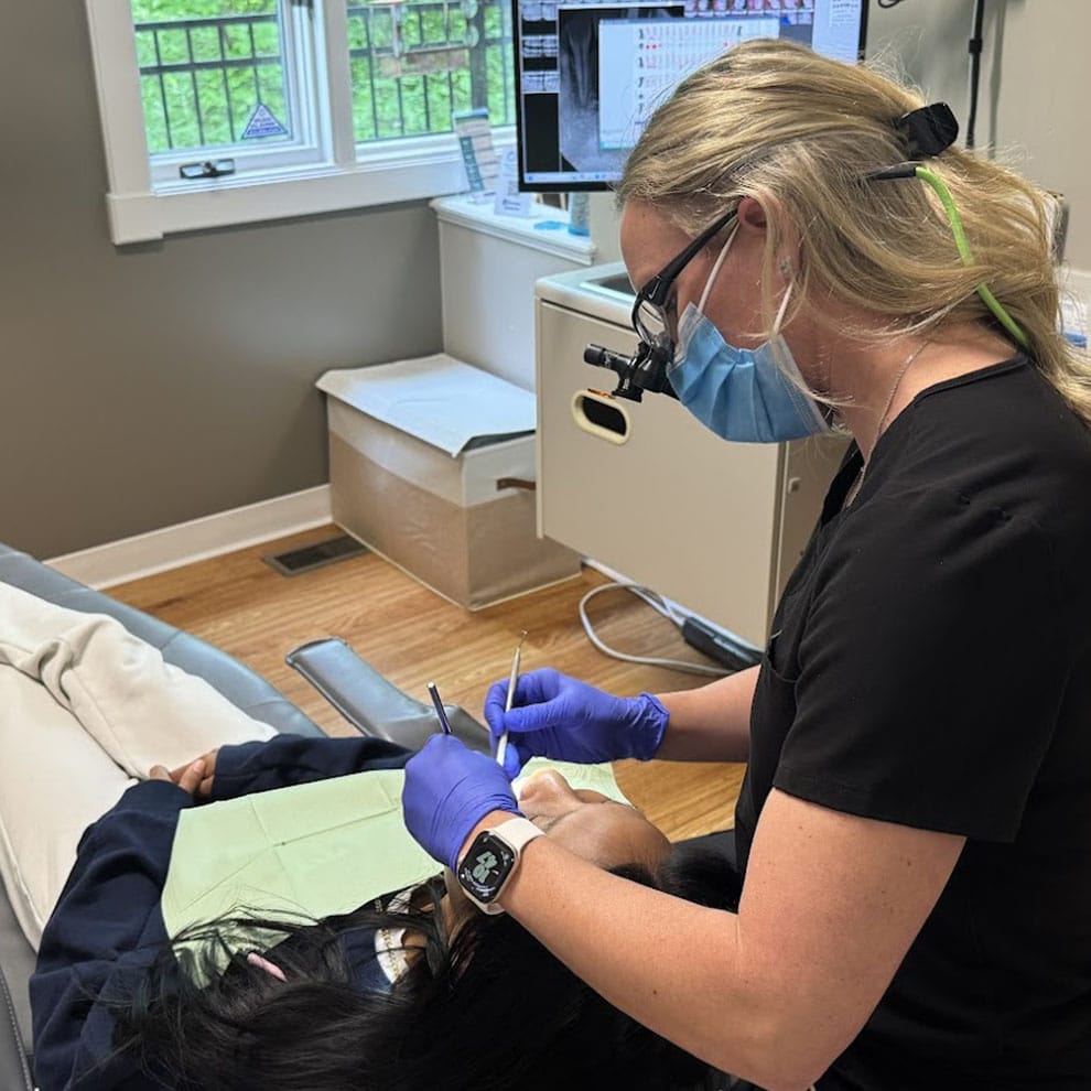 Greenwood Dental Smiles Assistant Performing Teeth Whitening
