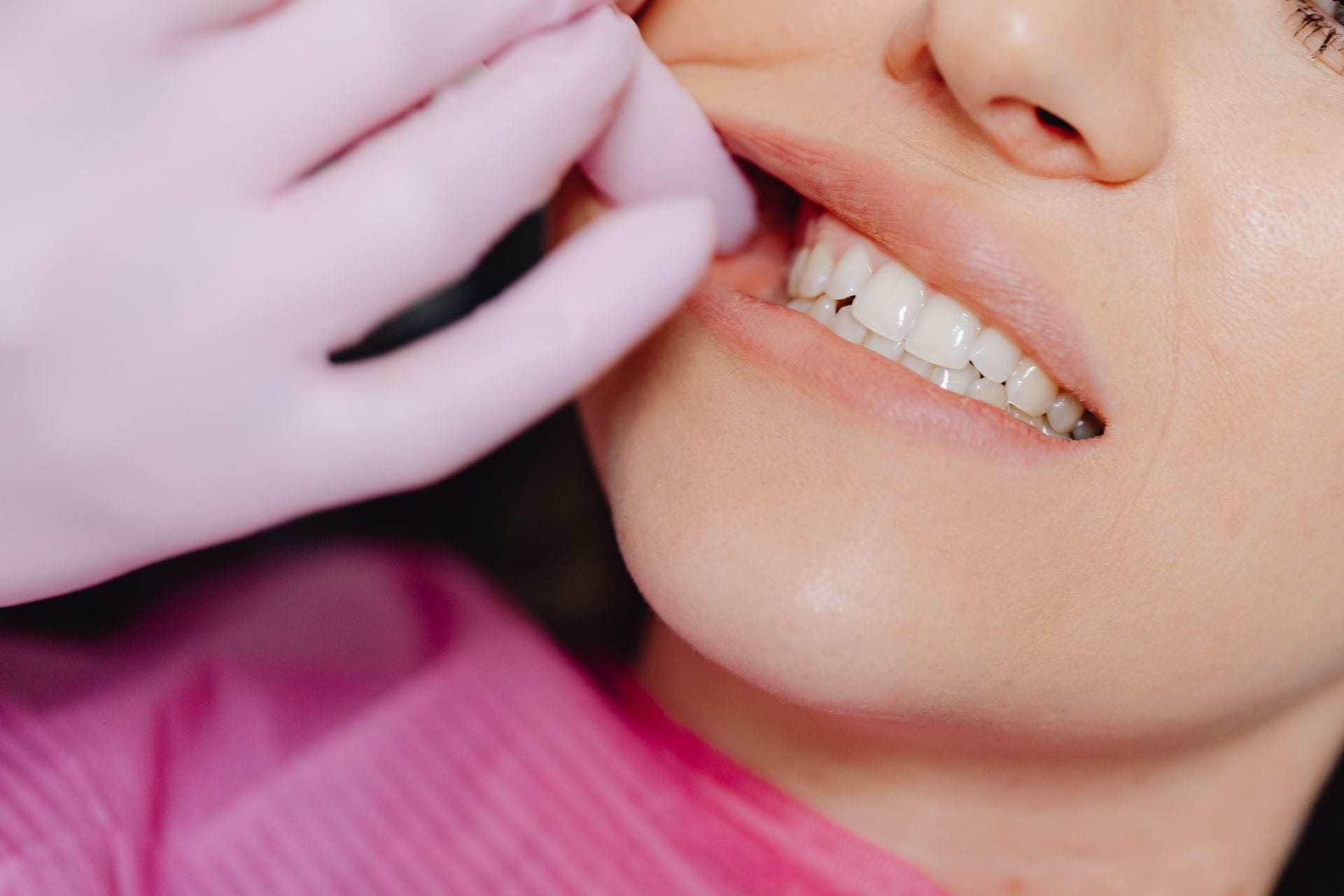 Inspecting a patient's teeth Greenwood Dental Smiles Clinical Team Photo